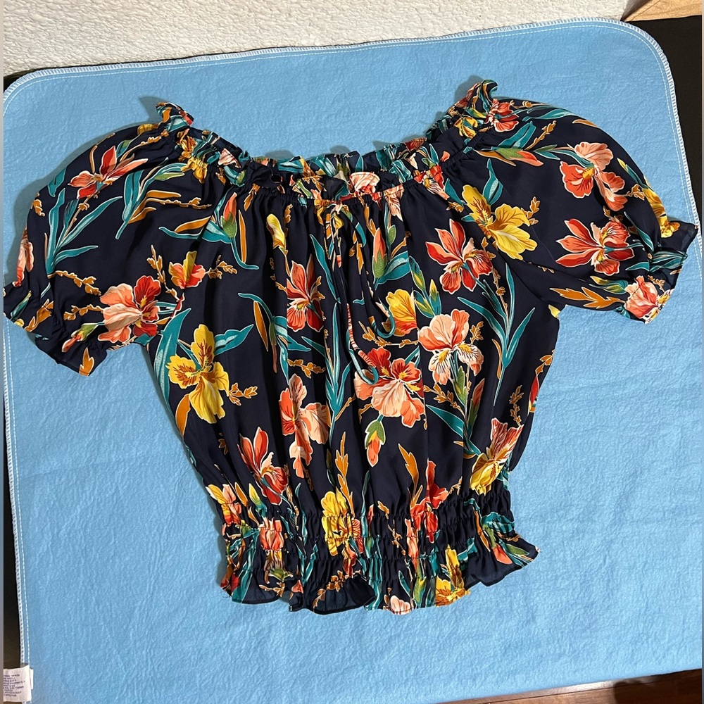 Get the feel of Hawaii with this beautiful floral print top.